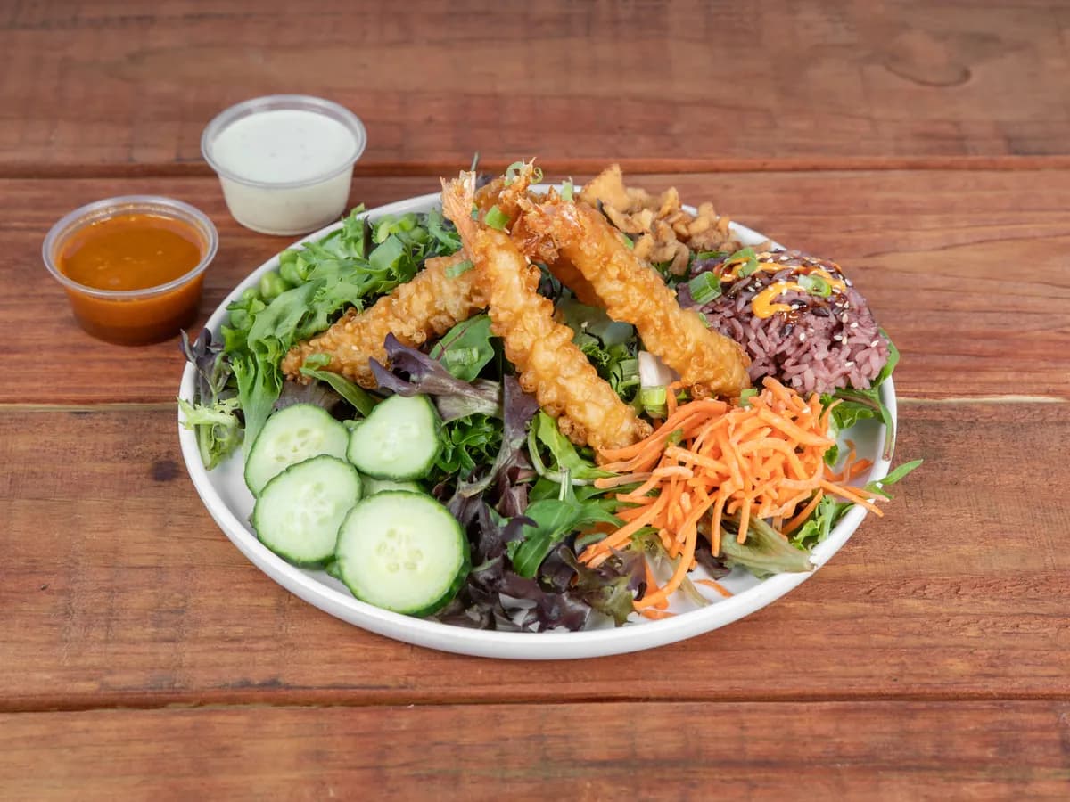 A Seoul Salad topped with shrimp tempura
