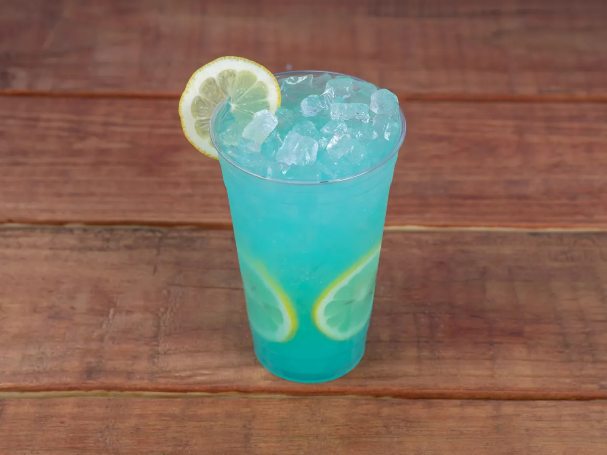 A Badah Blue lemonade over ice with a lemon wheel